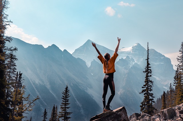 Woman solo enjoying view in mountains of Canada.