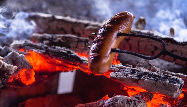 Frankfurter over a fire.