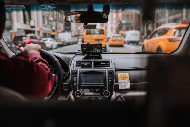 View from sitting in the backseat of a taxi, which is rude in other countries.