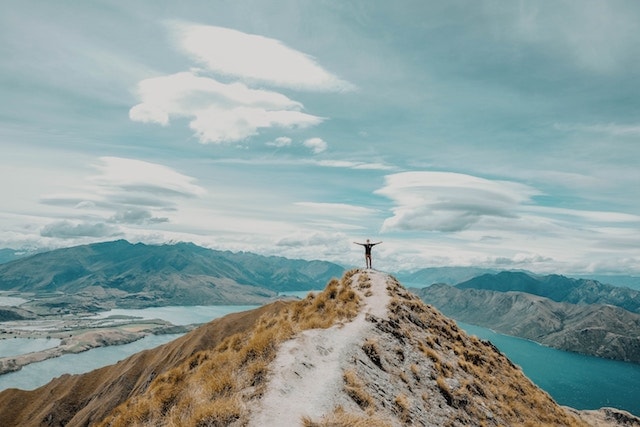 a person standing solo on a mountain in New Zealand.