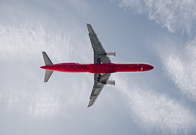 A plane flying through the air. 