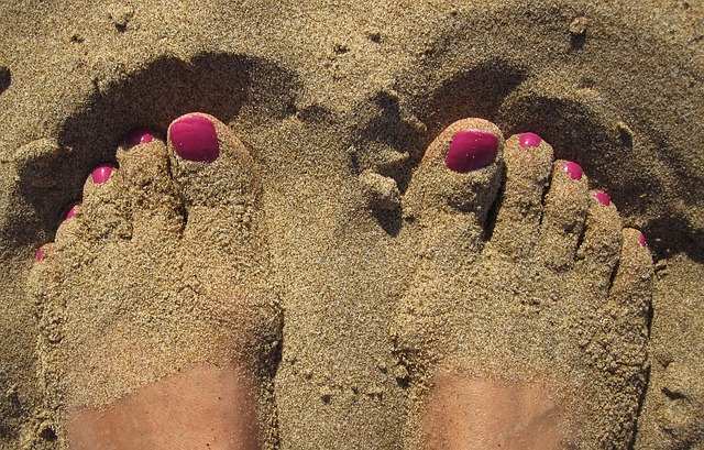 woman's toes in the sand. 