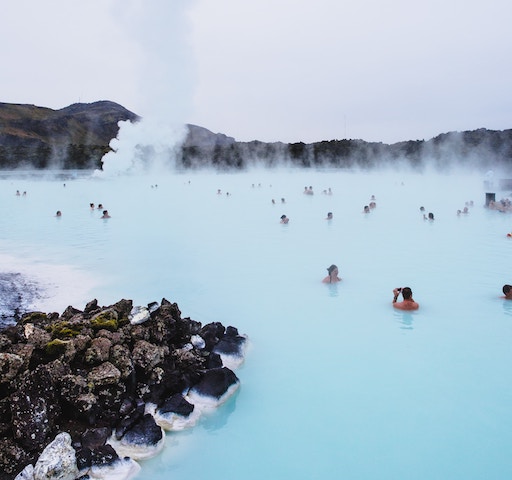 People swimming in the Blue Lagoon in Iceland. 