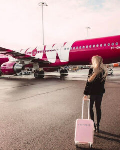 a photo of a WOW Air plane and passenger.
