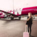 a photo of a WOW Air plane and passenger.