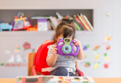 Child playing with a camera